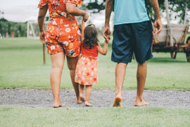 man-and-woman-holding-their-daughter